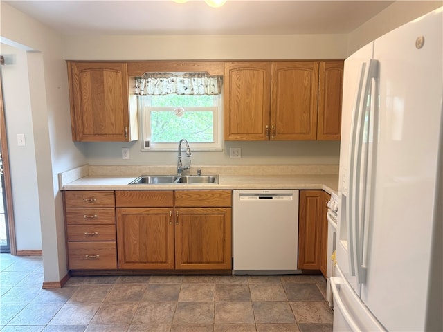 199 Lyon Ln, Lancaster Twp, PA 16037 - kitchen with white appliances, a sink, brown cabinets, and light countertops