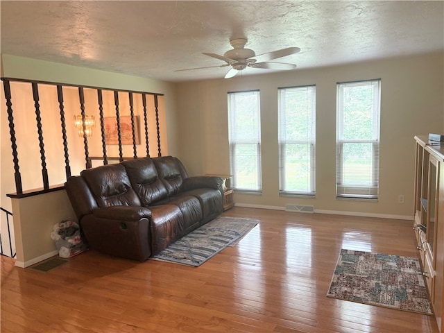 199 Lyon Ln, Lancaster Twp, PA 16037 - living area with baseboards, ceiling fan, hardwood / wood-style flooring, and a textured ceiling