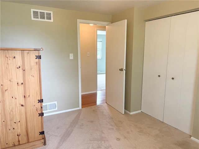 199 Lyon Ln, Lancaster Twp, PA 16037 - unfurnished bedroom featuring light colored carpet, a closet, and baseboards