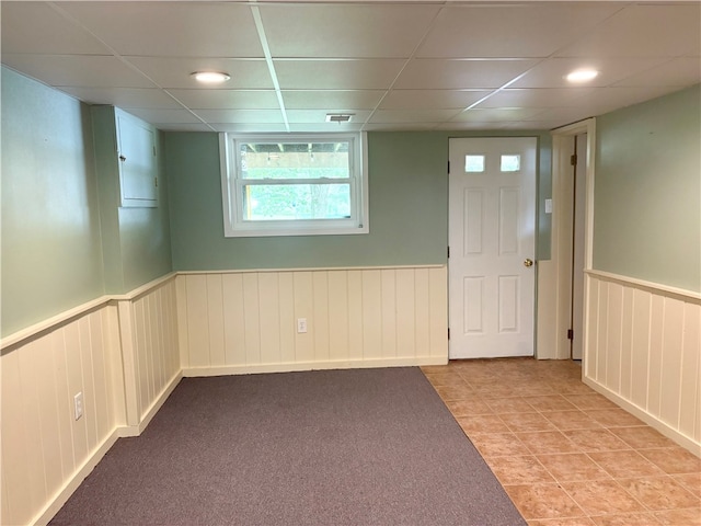 199 Lyon Ln, Lancaster Twp, PA 16037 - unfurnished room featuring a wainscoted wall, a drop ceiling, and light tile patterned floors