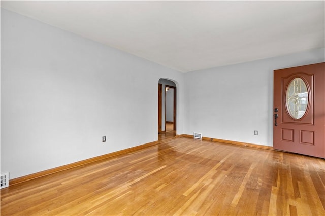 1311 Agnew Ave, Hopewell Twp Bea, PA 15001 - spare room featuring arched walkways, light wood-style flooring, and baseboards
