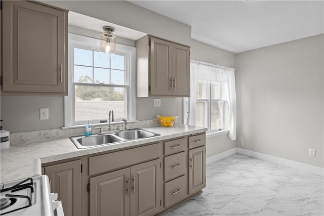 1311 Agnew Ave, Hopewell Twp Bea, PA 15001 - kitchen featuring a sink, light marble finish flooring, light countertops, and gray cabinets