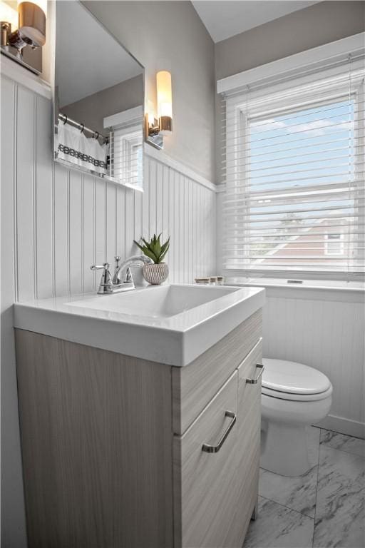 1311 Agnew Ave, Hopewell Twp Bea, PA 15001 - full bath with marble finish floors, vanity, toilet, a wainscoted wall, and a decorative wall