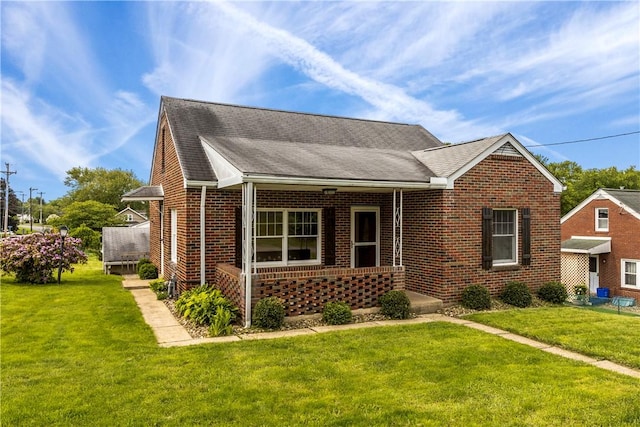 1311 Agnew Ave, Hopewell Twp Bea, PA 15001 - view of front facade featuring brick siding, a front yard, and a shingled roof