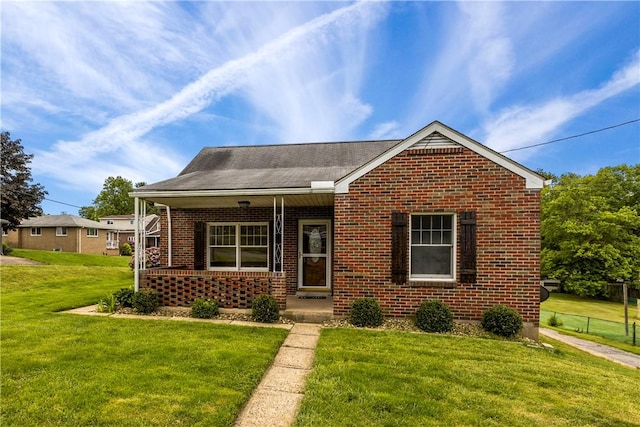 1311 Agnew Ave, Hopewell Twp Bea, PA 15001 - bungalow-style house featuring brick siding, a front yard, and a porch