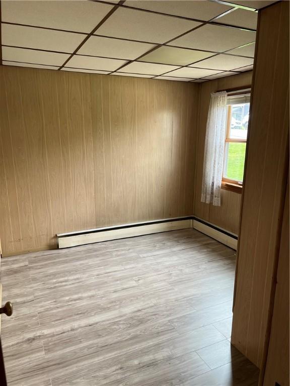 35 2nd, Cecil, PA 15055 - spare room featuring a paneled ceiling, wooden walls, and wood finished floors