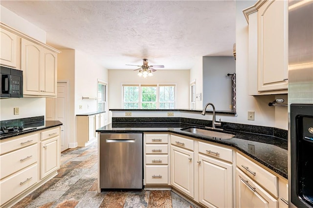 1500 Fitzgerald Ct, Unity Twp, PA 15601 - kitchen with dishwasher, a sink, black microwave, a ceiling fan, and a peninsula
