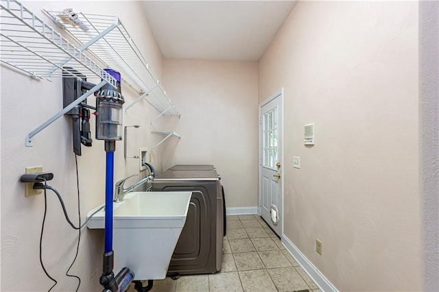 1500 Fitzgerald Ct, Unity Twp, PA 15601 - laundry room with washing machine and clothes dryer, baseboards, and light tile patterned floors