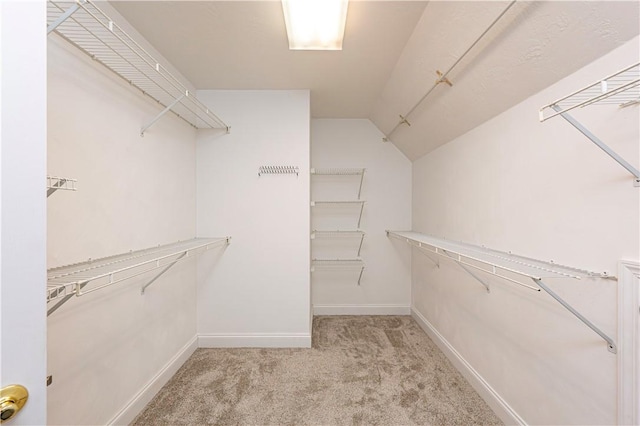 1500 Fitzgerald Ct, Unity Twp, PA 15601 - walk in closet featuring light carpet and lofted ceiling