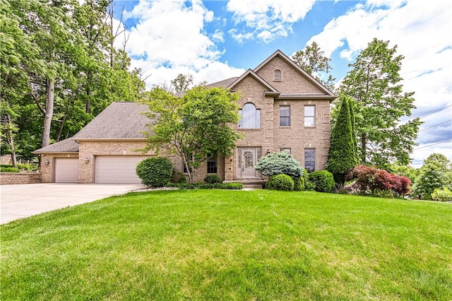 1500 Fitzgerald Ct, Unity Twp, PA 15601 - view of front of property with brick siding, concrete driveway, an attached garage, and a front lawn