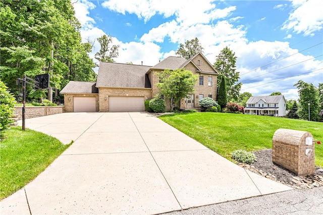 1500 Fitzgerald Ct, Unity Twp, PA 15601 - view of front of home featuring brick siding, an attached garage, driveway, a front yard, and roof with shingles