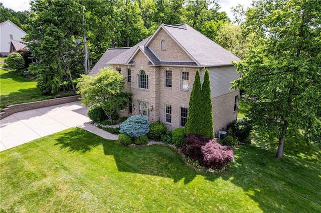 1500 Fitzgerald Ct, Unity Twp, PA 15601 - view of front facade featuring brick siding, a front lawn, and roof with shingles