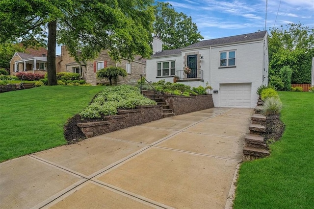 501 Parkview Dr, Mt Lebanon, PA 15243 - view of front of property with a front lawn, a garage, concrete driveway, a chimney, and stairway