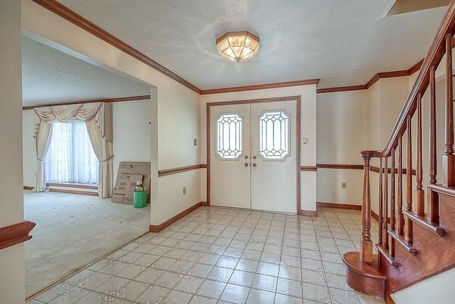 401 Chelsea Dr, Jefferson Hills, PA 15025 - entryway featuring baseboards, a textured ceiling, stairs, ornamental molding, and light colored carpet