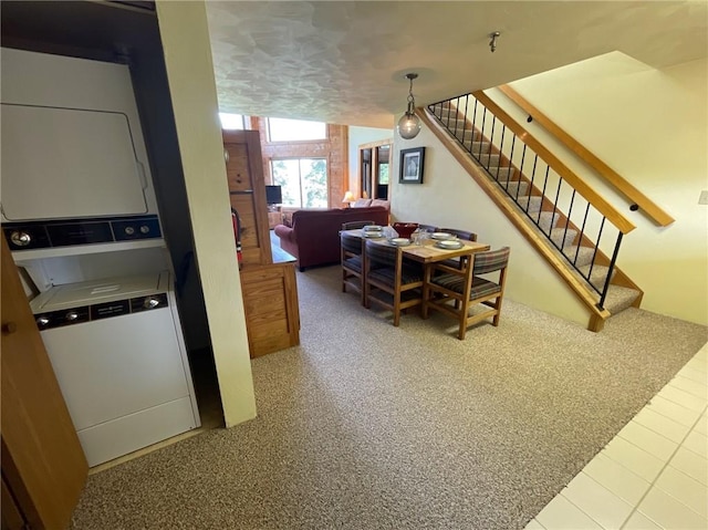 B45A Stoneridge Dr, Seven Springs Resort, PA 15557 - dining room featuring stacked washer / drying machine and stairs