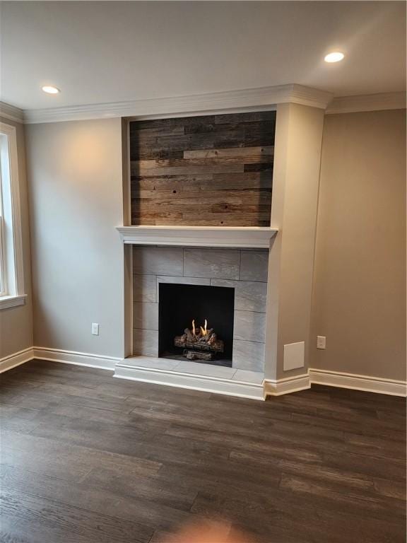 165 45th St, Lawrenceville, PA 15201 - detailed view of ornamental molding, baseboards, wood finished floors, a tile fireplace, and recessed lighting