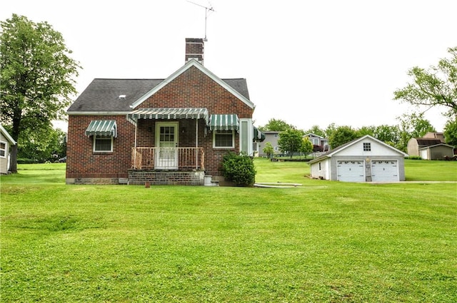 403 Bull Run Rd, Luzerne Twp, PA 15417 - view of front of home with a garage, a front yard, a chimney, and an outbuilding