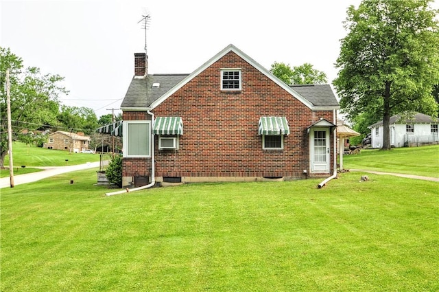 403 Bull Run Rd, Luzerne Twp, PA 15417 - view of front of home with a front yard, a chimney, roof with shingles, and brick siding
