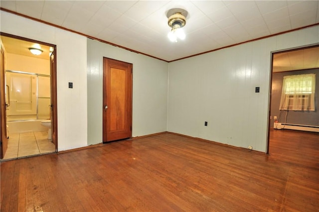 403 Bull Run Rd, Luzerne Twp, PA 15417 - empty room with hardwood / wood-style floors, crown molding, a baseboard heating unit, and baseboards