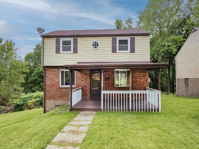 129 Martinique Dr, Penn Hills, PA 15235 - view of front of house featuring a porch, a front lawn, and brick siding