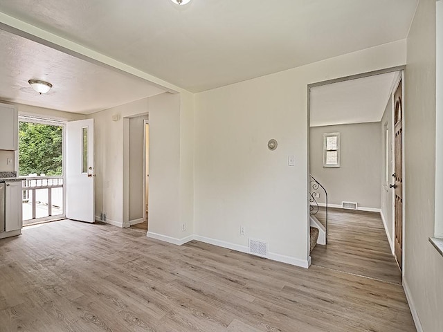 129 Martinique Dr, Penn Hills, PA 15235 - spare room with healthy amount of natural light, light wood finished floors, and baseboards