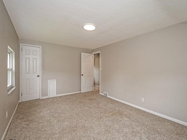 129 Martinique Dr, Penn Hills, PA 15235 - unfurnished bedroom with baseboards and light carpet