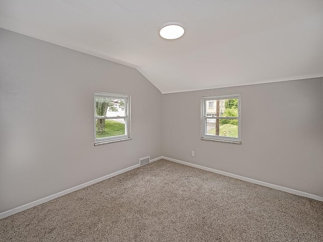 129 Martinique Dr, Penn Hills, PA 15235 - spare room with lofted ceiling, plenty of natural light, baseboards, and carpet flooring