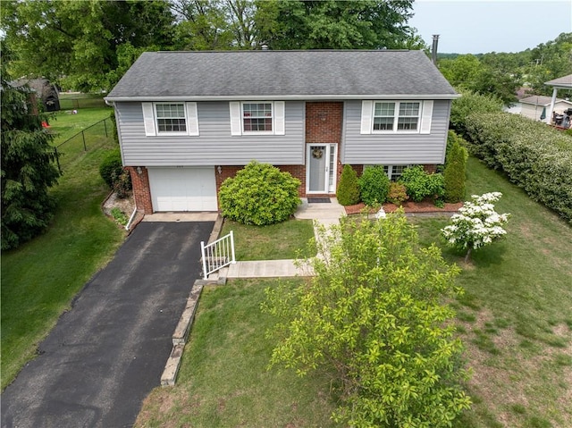 205 Van Dr, Bullskin Twp, PA 15425 - raised ranch with brick siding, asphalt driveway, a garage, and a shingled roof