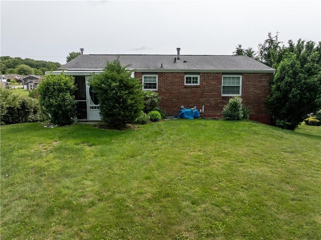 205 Van Dr, Bullskin Twp, PA 15425 - back of house featuring a lawn and brick siding