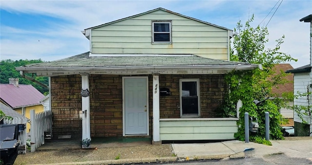 840 Prospect Ave, Charleroi Boro, PA 15022 - view of front of home with covered porch, a shingled roof, and stone siding
