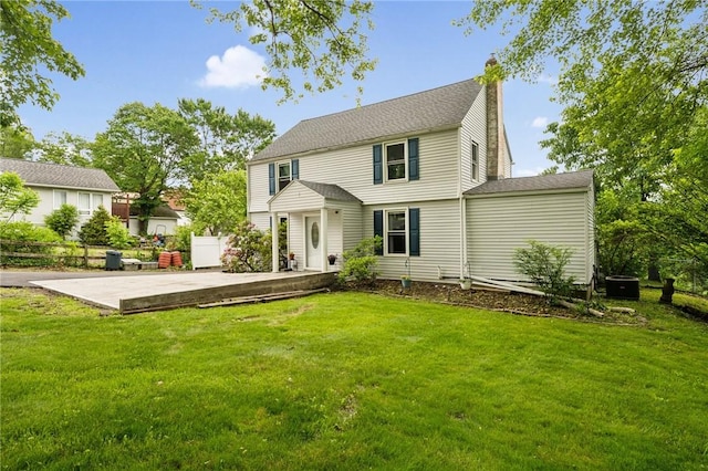 2510 7th St, New Kensington, PA 15068 - back of property with a chimney, a patio, and central air condition unit