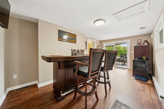 2510 7th St, New Kensington, PA 15068 - indoor dry bar with wood finished floors, baseboards, and a baseboard heating unit
