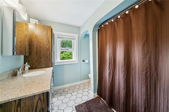 2510 7th St, New Kensington, PA 15068 - full bathroom featuring vanity, baseboards, tile patterned floors, and toilet