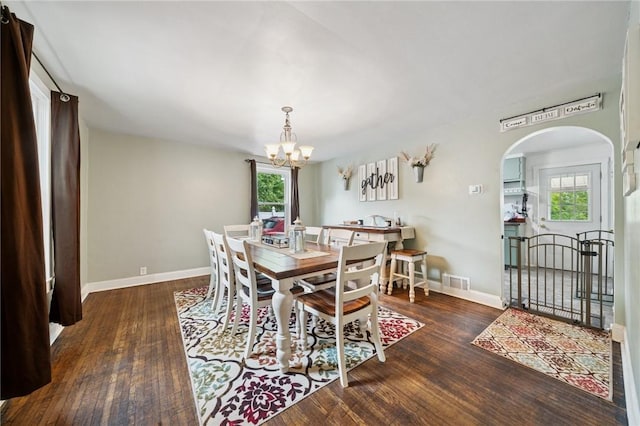 2510 7th St, New Kensington, PA 15068 - dining room with arched walkways, wood finished floors, healthy amount of natural light, and a chandelier