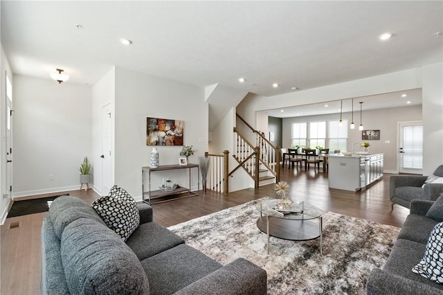 150 Moyer Hill Dr, Cranberry Twp, PA 16066 - living area with stairway, dark wood-type flooring, recessed lighting, and baseboards