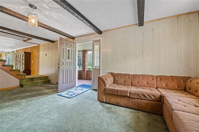 600 Pineview Dr Unit 590, Elizabeth Twp/Boro, PA 15037 - carpeted living room featuring beamed ceiling, a textured ceiling, wooden walls, and stairs
