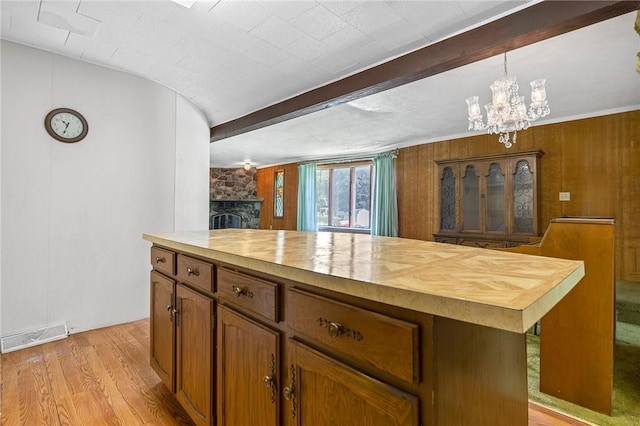 600 Pineview Dr Unit 590, Elizabeth Twp/Boro, PA 15037 - kitchen featuring wood counters, a chandelier, beam ceiling, light wood-type flooring, and brown cabinets