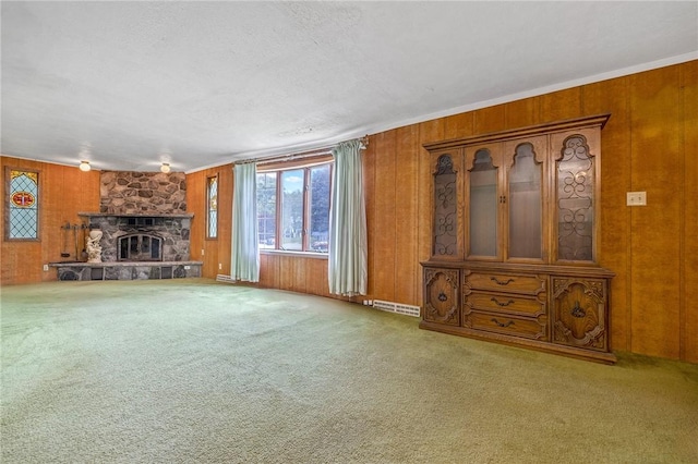 600 Pineview Dr Unit 590, Elizabeth Twp/Boro, PA 15037 - unfurnished living room with wood walls, a fireplace, and carpet flooring