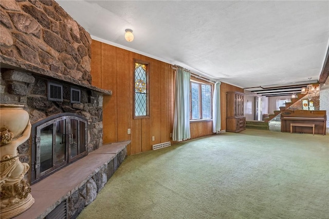 600 Pineview Dr Unit 590, Elizabeth Twp/Boro, PA 15037 - unfurnished living room featuring a fireplace, carpet, stairs, wood walls, and ornamental molding