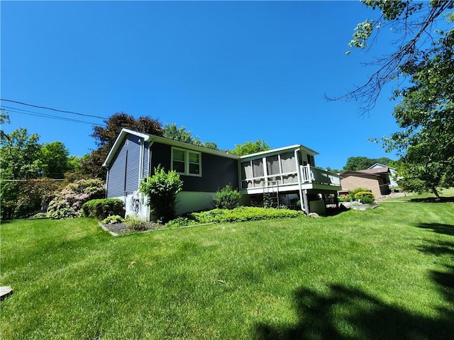 911 Aztec Trl, Coolspring Twp, PA 16137 - rear view of property with a sunroom and a yard