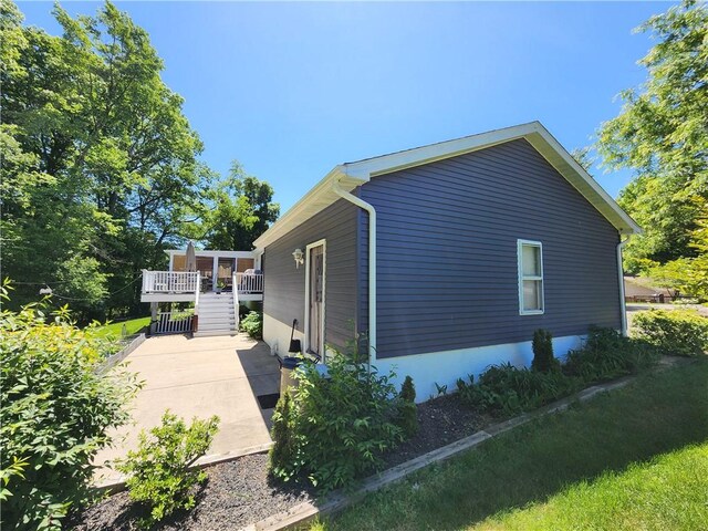 911 Aztec Trl, Coolspring Twp, PA 16137 - view of property exterior featuring stairway and a deck