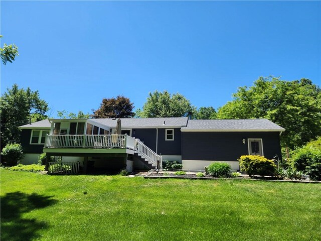 911 Aztec Trl, Coolspring Twp, PA 16137 - rear view of house with a lawn, stairs, a wooden deck, and roof with shingles