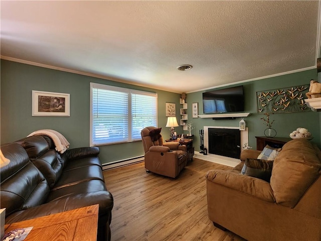911 Aztec Trl, Coolspring Twp, PA 16137 - living area with a baseboard radiator, ornamental molding, wood finished floors, a textured ceiling, and a fireplace