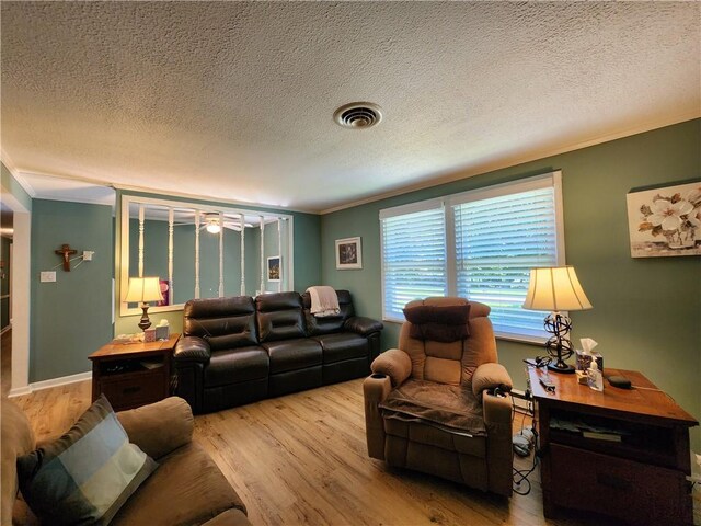 911 Aztec Trl, Coolspring Twp, PA 16137 - living room featuring crown molding, wood finished floors, ceiling fan, and a textured ceiling