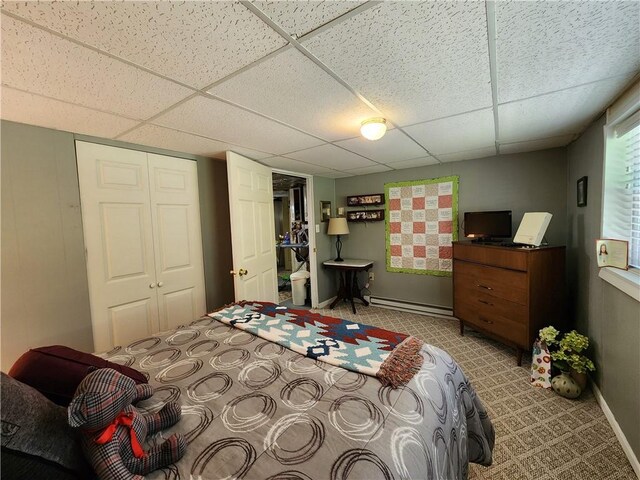 911 Aztec Trl, Coolspring Twp, PA 16137 - bedroom featuring a paneled ceiling, a baseboard heating unit, a closet, and baseboards