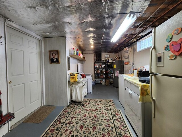 911 Aztec Trl, Coolspring Twp, PA 16137 - below grade area with freestanding refrigerator and water heater