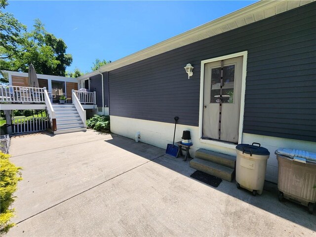 911 Aztec Trl, Coolspring Twp, PA 16137 - view of patio / terrace featuring entry steps, a wooden deck, and stairway