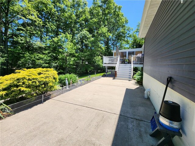 911 Aztec Trl, Coolspring Twp, PA 16137 - view of patio with stairs and view of wooded area
