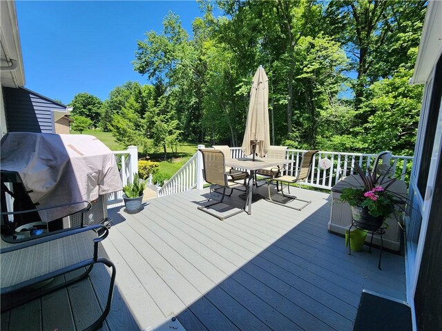 911 Aztec Trl, Coolspring Twp, PA 16137 - deck featuring outdoor dining area, area for grilling, and view of wooded area