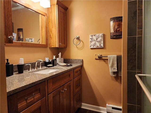 911 Aztec Trl, Coolspring Twp, PA 16137 - bathroom featuring a baseboard radiator, vanity, baseboards, and wood finished floors